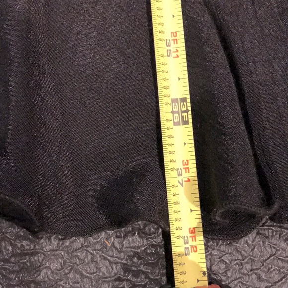 Black Skirt with High-Low Hemline and front slit with cascading ruffles. - Picture 10 of 14